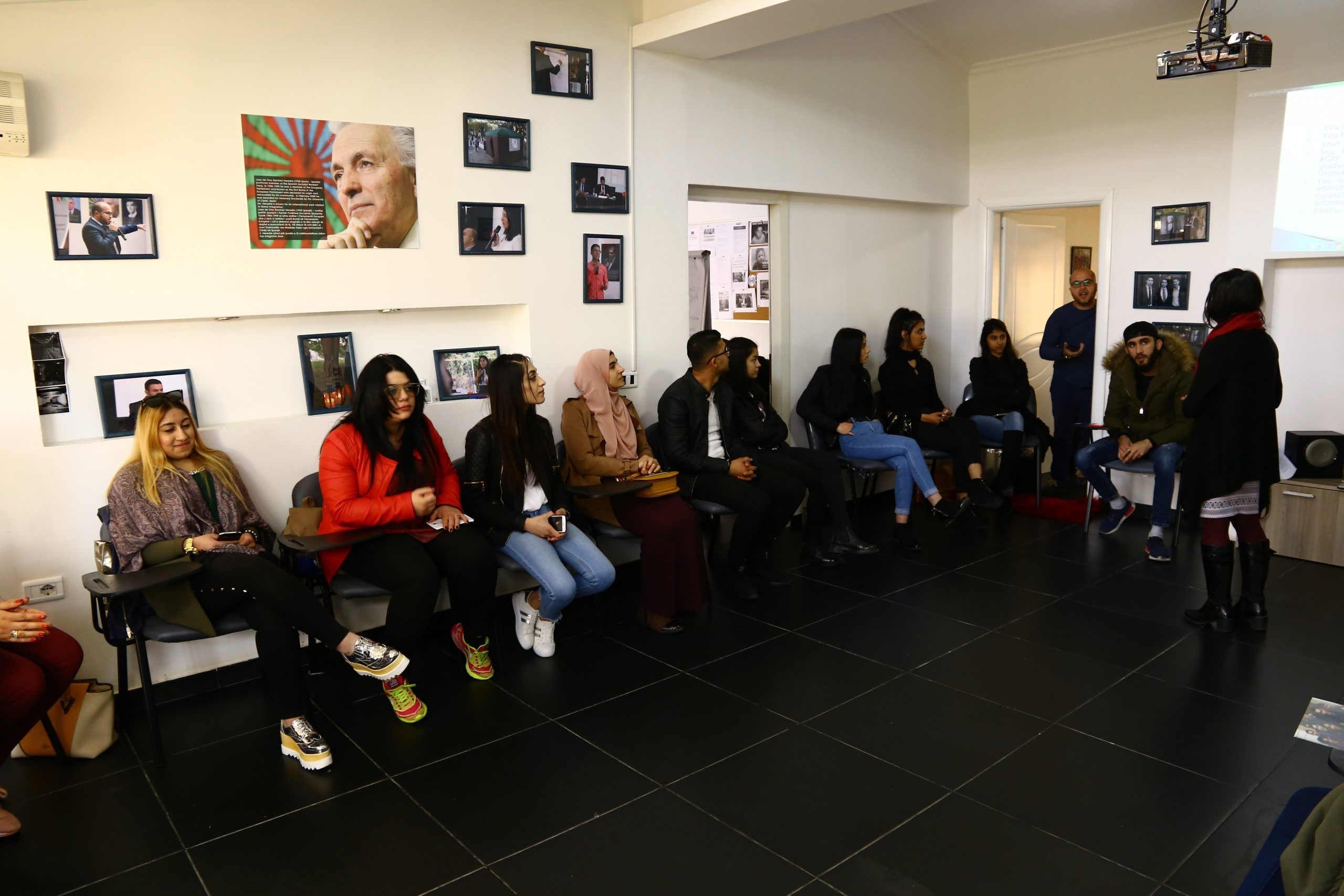 Participants seated around a room during a training session