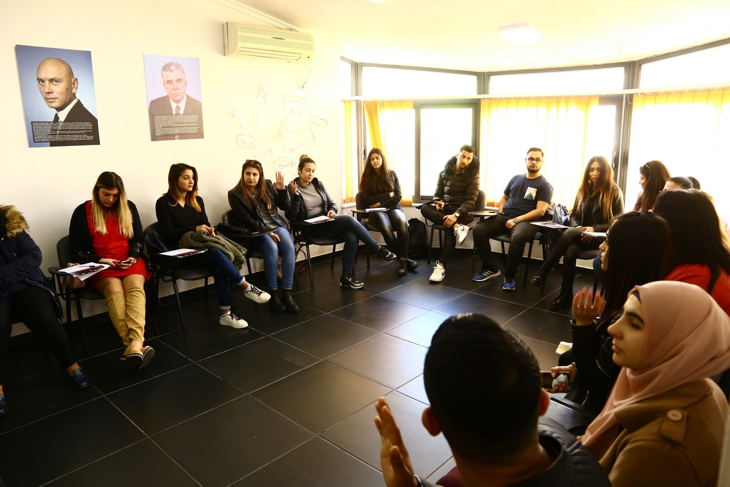 Students taking part in a group discussion during a training session